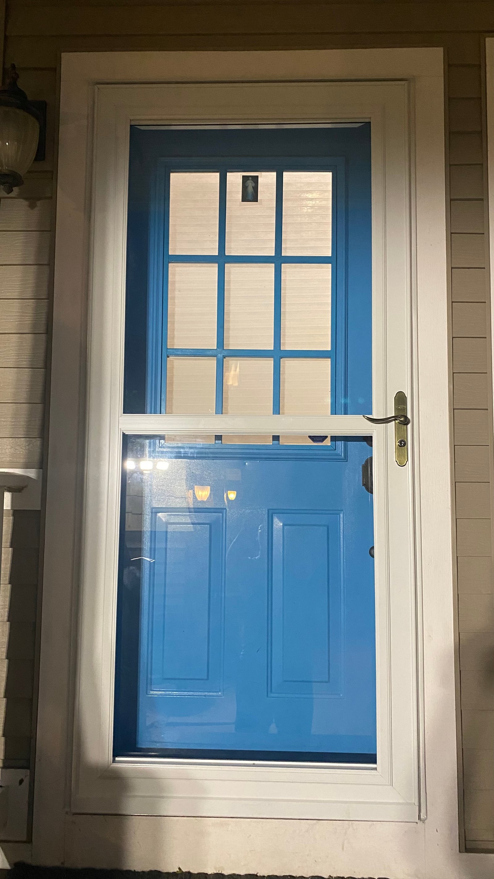 After, night close-up of the new storm door