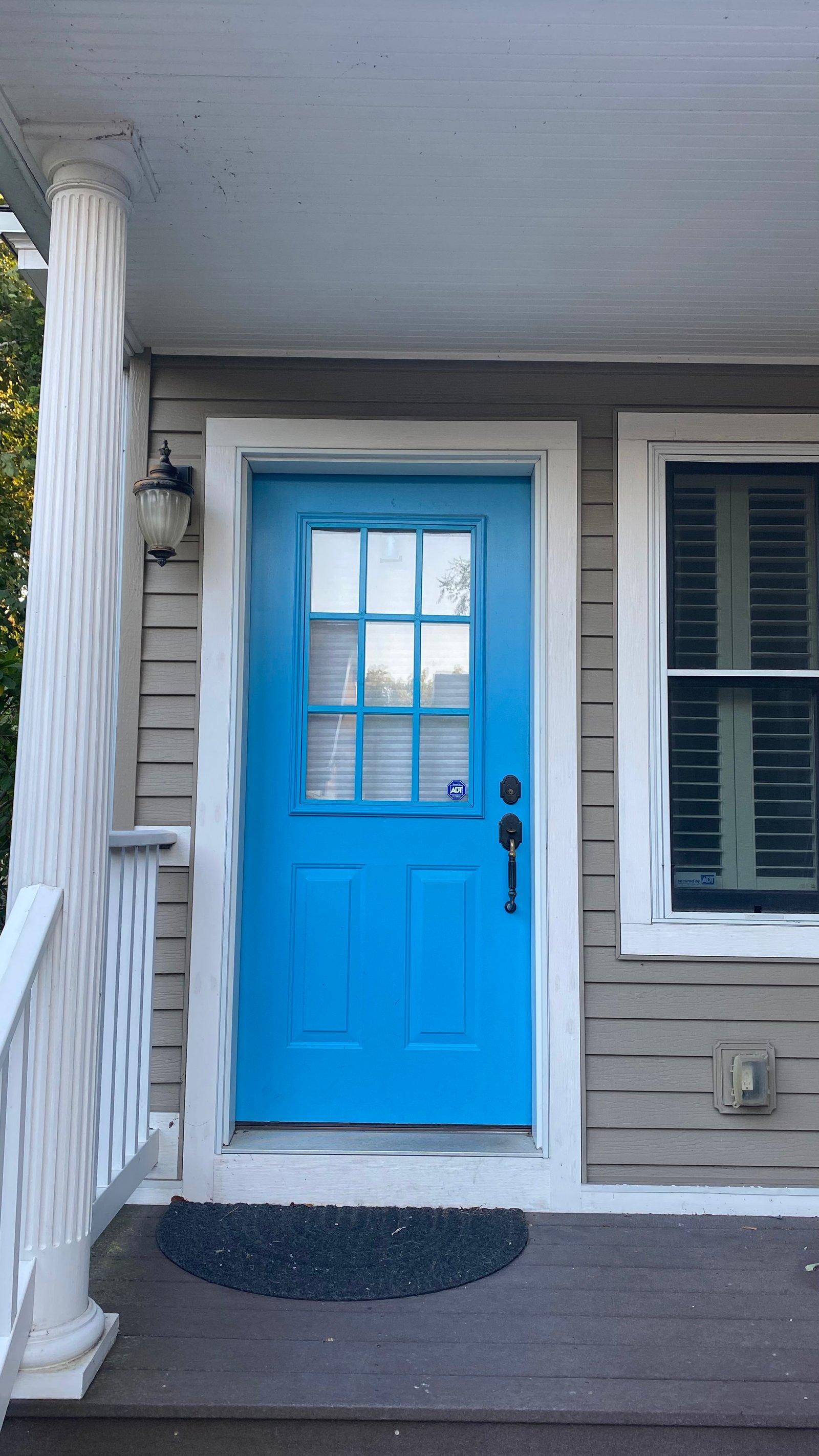 Before: blue entry door with no storm door installed